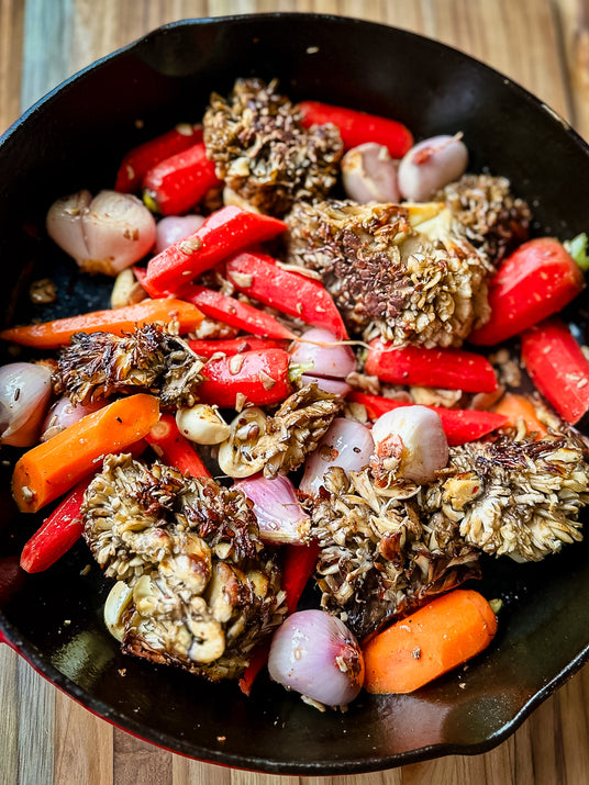 a pan of vegetables on a table - organic mushrooms minnesota